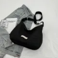 Black pleated bubble shoulder crossbody bag, casual Korean style dumpling tote bag for women. - Black