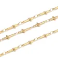 Close-up detail of golden cross chain links, perfect for DIY jewelry making and bracelets. - 1 Meter / Gold