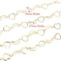 Close-up detail of stainless steel hollow heart and crescent moon chains for DIY jewelry making. - 1m / Gold Moon and Heart Chain