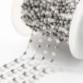 Close-up detail of stainless steel pearl chain, perfect for DIY jewelry making and crafts. - 1m / Artificial Pearl and Steel Beads 3mm