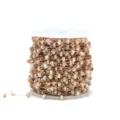Close-up of beaded chain spool, gold-colored metal links with natural stone beads for DIY crafts - 1m / Pink