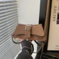 Stylish brown leopard print shoulder bag with metal chain and buckle strap for women. - Brown