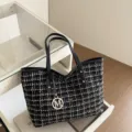 Black and white tweed plaid tote bag with chic black leather handles and gold M charm. - Black
