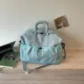 Hellblaue Reisetasche mit großer Kapazität, Kordelzug-Fronttasche und verstellbarem Schultergurt - Blau