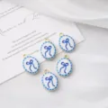 Close-up view of oval blue bow charm pendants, perfect for DIY jewelry accessories. - Blue Bow / 1 Piece (20mm*14mm)