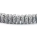 Detail shot of gray porous volcanic lava stone spacer beads for DIY jewelry making and bracelets. - 4*6mm / Gun Grey