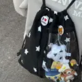 Mochila ita negra con estampado de estrellas y bolsillo transparente para peluches lindos. - Estrella Negra