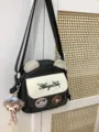 Bolso ita de lona japonesa detalle con orejas de oso y ventana frontal transparente. - Con Tablero de Insignias / Negro