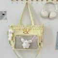 Cute Japanese style yellow tote backpack with clear front pocket, plush toy, ruffles and bow. - Shoulder Bag with Two Pendants / Yellow