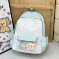 Mochila ita verde menta japonesa con topos y estrellas, bolsillo frontal transparente y peluche - Verde