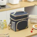 Double layer insulated lunch bag with crossbody strap and portable handle for office picnic. - Navy Blue