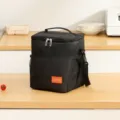 Black insulated lunch bag with shoulder strap, durable cooler bag for daily meal prep. - Black