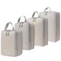 Set van 4 beige reisorganizers inpakblokken compressietassen met handvat en sterke ritsen. - Compressie 4-Delige Set Beige