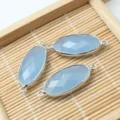 Pendentif connecteur ovale en pierre gemme facettée bleue, idéal pour la création de bijoux. - Jade Bleu