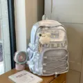 Sac à dos d'étudiant argenté léger avec poche avant transparente et charm en peluche. - Avec Charme / Argent