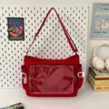 Bolso bandolera de lona roja con bolsillo frontal transparente, bolso mensajero minimalista. - Rojo