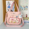 Cute pink polka dot ACG itabag with transparent window and plush charms, perfect for students. - With Charm / Pink