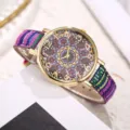 Boho style vintage watch detail, colorful woven canvas strap and mandala dial close-up. - Style K