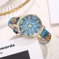 Close up view of bohemian style women quartz watch with colorful woven fabric strap and mandala dial. - Style L