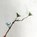 Artificial flower branch, flexible brown twisted vine with green leaves and blue flowers for decor. - Blue Hydrangea