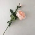 Detailed close-up view of a single artificial pink rose branch, showing flower and leaves. - Flesh Pink