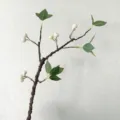 Artificial foam branch with white berries and green leaves, perfect for home decor and weddings. - White Fruit