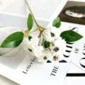 White artificial multi-head rose flower branch, realistic silk floral decor for wedding and home. - White