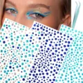 Face rhinestone stickers detail view, showing blue crystal gems and applicator tweezers. - Blue