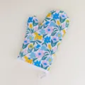 Floral pattern oven mitt detail view, showing charming blue and yellow flowers with green leaf print. - Monet Garden 2