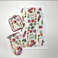 Detailed view of kitchen towel and oven mitt set featuring watercolor vegetable print design. - 27*17 / Vegetable