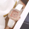 Close-up detail of square diamond women quartz watch with white leather strap and dial - Rose Gold Case White Dial