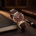 Women quartz watch with brown leather strap, rose gold case and leaf textured dial. - Coffee