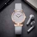 Women's quartz watch with grey leather strap leaf embossed dial and rose gold bow detail. - Light Gray