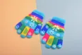 Colorful striped kids gloves with cute snowflake patterns and anti-slip grip for winter. - One Size / Medium Blue