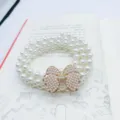 White multi-strand pearl waist belt with sparkling crystal bow clasp, elegant dress accessory variant. - B-Bowknot - Gold