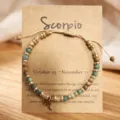 Bracelet de perles en pierre naturelle Scorpion avec charm zodiaque en acier sur carte. - Scorpion