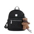 Detailed view of black woven texture leather backpack with cute fluffy bear pendant charm. - Small (With Charm) / Black