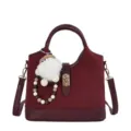 Burgundy bucket bag detail, premium suede texture, metal lock closure, stylish keyring. - With Pendant / Red