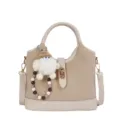 Chic beige bucket bag with cute gnome keychain, stylish PU leather handbag and shoulder bag. - With Pendant / Off White