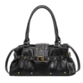 Bolso de hombro estilo moto vintage negro para mujer con tachuelas metálicas y hebilla. - Negro