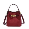 Wine red suede bucket bag with patent leather trim and metal lock closure, elegant daily crossbody. - Without Pendant / Red