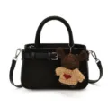 Stylish black leather shoulder handbag with cute knit bear pendant for daily wear. - With Pendant / Black