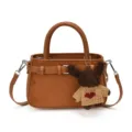 Brown suede handbag for women, stylish crossbody shoulder bag with cute puppy plush pendant charm. - Brown