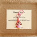 Detailed shot of cute cartoon girl keychain pendant with pink hook, perfect bag charm accessory. - Pink