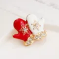 Close-up view of a Christmas mitten brooch, featuring red white enamel, rhinestones, and snowflakes. - Christmas Mittens Style (XZ357-28)