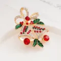 Detailed close-up of a charming Christmas bell and bow brooch, sparkling crystal rhinestones. - Bowknot and Bell Style (XZ357-31)