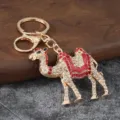 Detailed view of a creative rhinestone encrusted camel keychain with colorful enamel and metal ring. - Camel 1 Style / Red