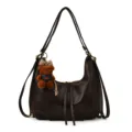 Detail shot of the dark brown convertible hobo backpack featuring cute bear charm. - With Pendant / Coffee