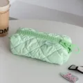 Green quilted cosmetic bag with large zipper detail, minimalist travel pouch - Green