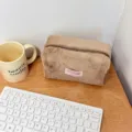 Cozy brown plush cosmetic bag, large capacity fluffy makeup pouch for daily travel and skincare. - Brown
